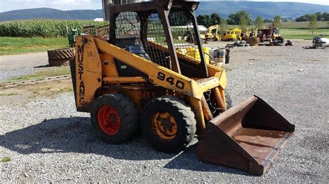 mustang 940 skid steer attachments|940 mustang skid steer used parts.